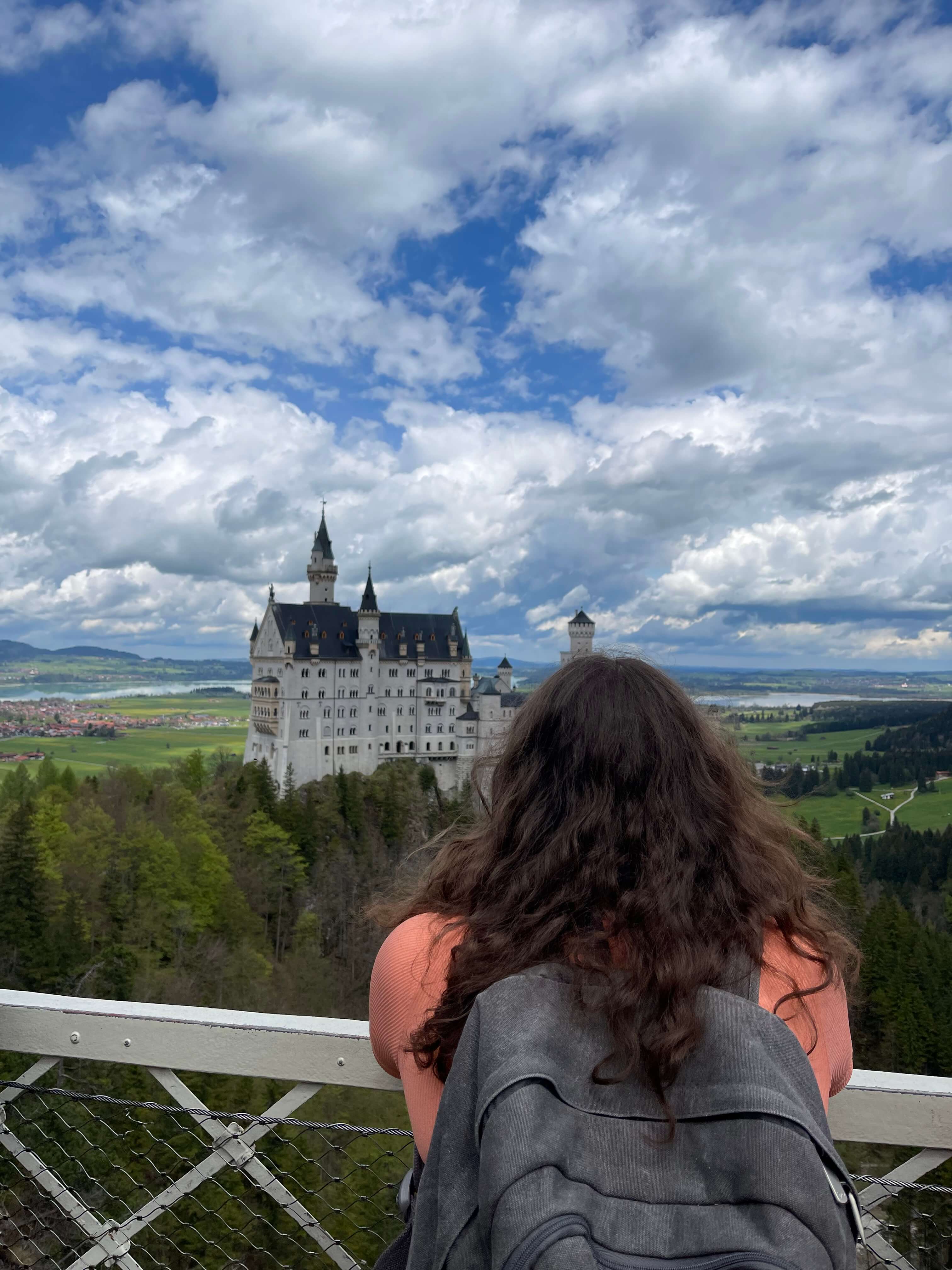 A student looking at a distant building